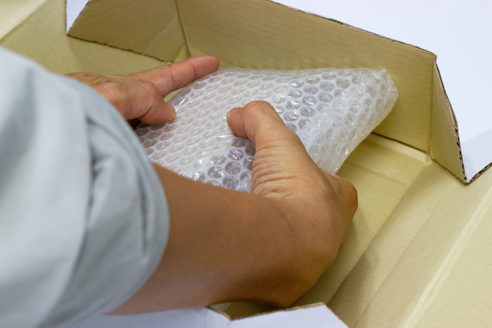 Packaging with bubble wrap for protection.