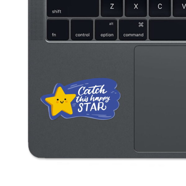 A sticker with the words "CATCH THIS HAPPY STAR"