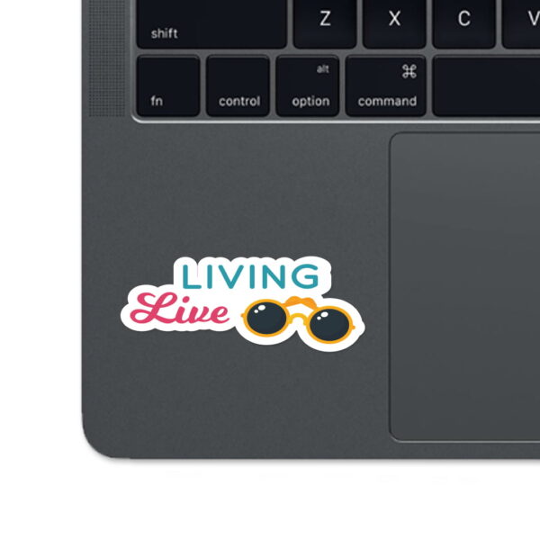 A sticker of the words "LIVING LIVE"