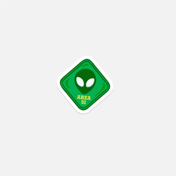 A sticker of a green alien with yellow text "AREA 51".
